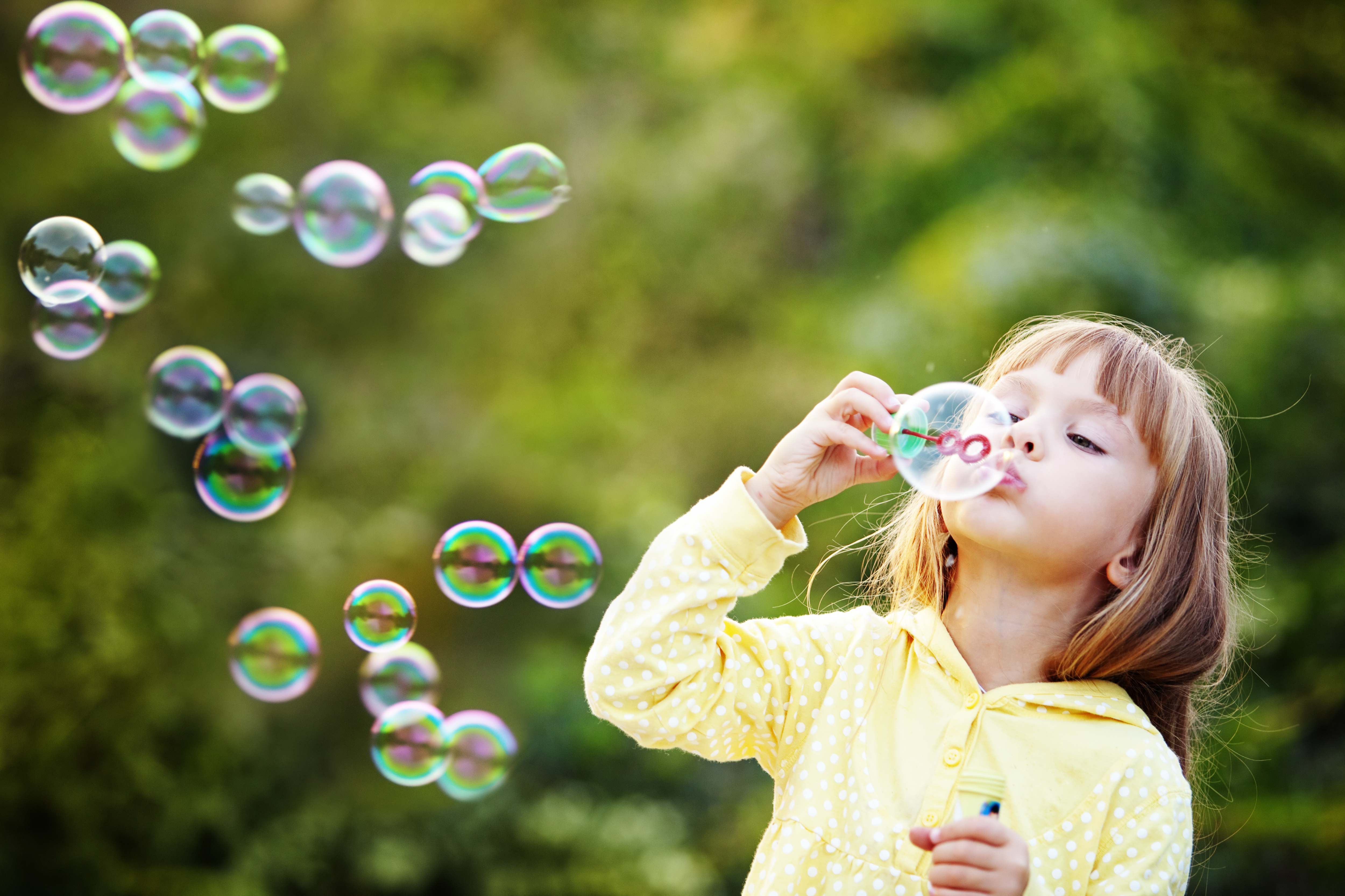 Girl blowing bubbles